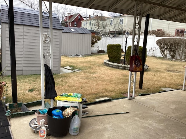 view of yard featuring a gazebo, a patio, and a storage unit