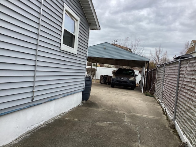 view of side of property with a carport