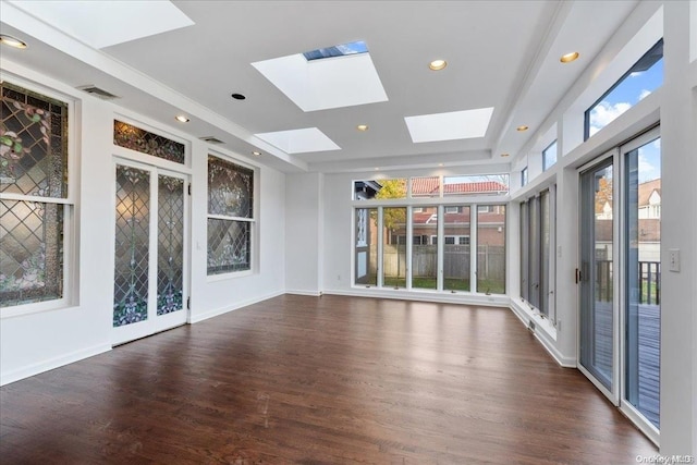 interior space featuring a skylight and dark wood-type flooring