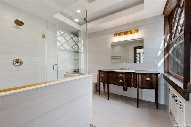 bathroom with radiator, concrete flooring, toilet, vanity, and a shower with shower door