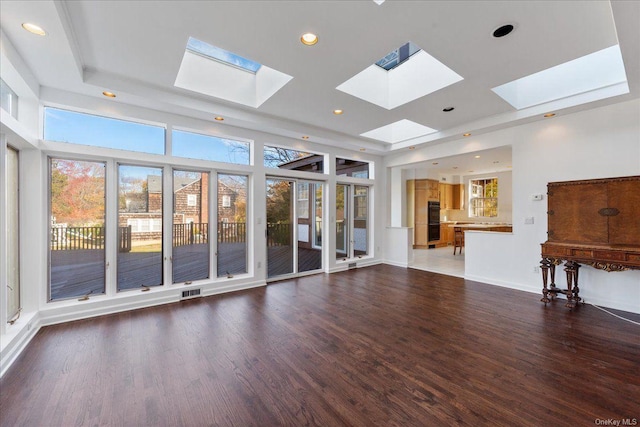 unfurnished living room featuring dark hardwood / wood-style floors