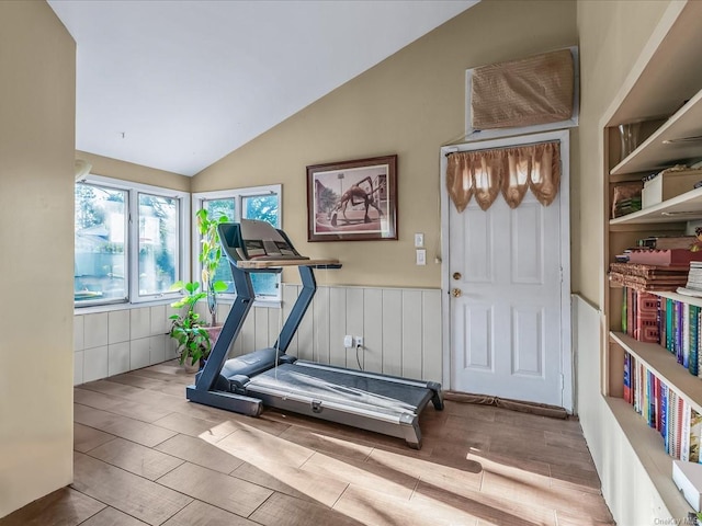 workout area with lofted ceiling