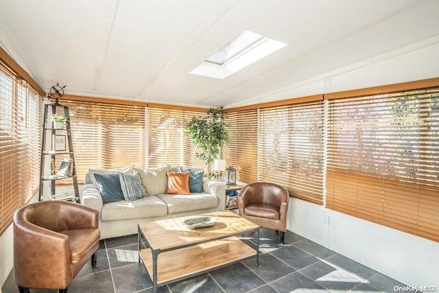 sunroom / solarium with vaulted ceiling with skylight