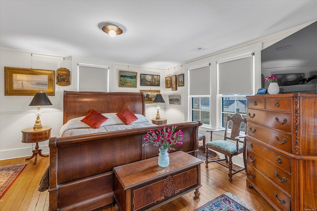 bedroom with light hardwood / wood-style flooring