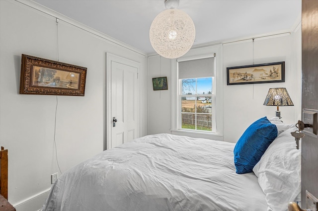 bedroom featuring crown molding