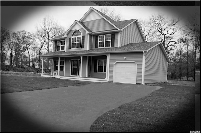 view of front of house with a porch and a garage