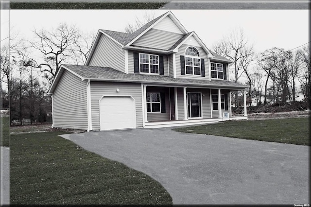 view of front of property with a front yard and a porch