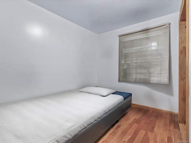 bedroom featuring hardwood / wood-style floors