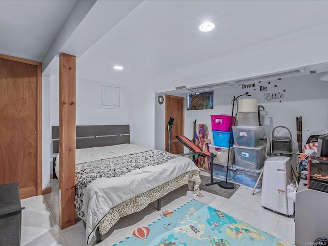 bedroom with light tile patterned floors