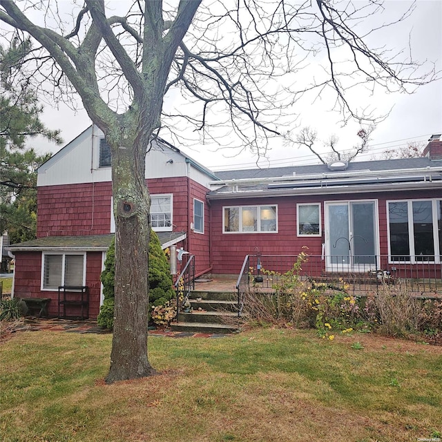 124 Mayhew Ave, Babylon, NY 11702 - rear view of house with a lawn