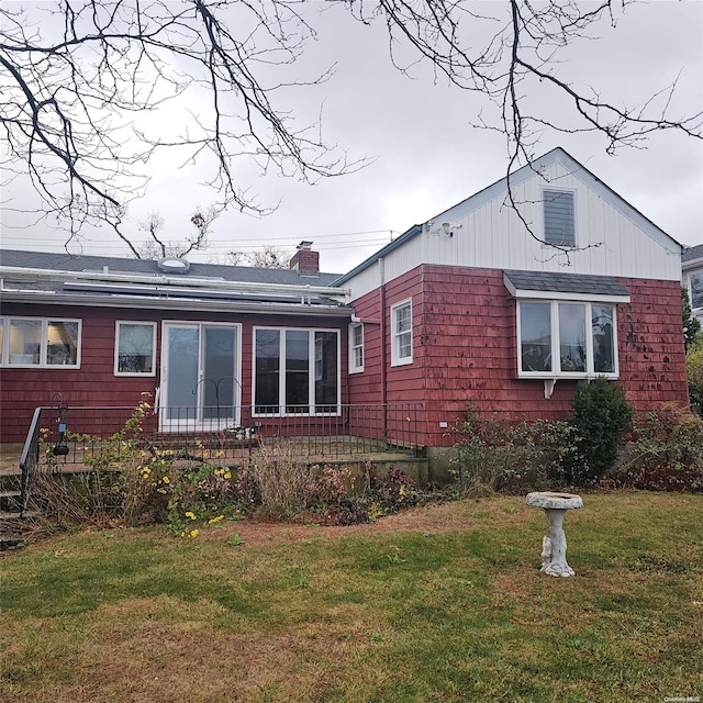 124 Mayhew Ave, Babylon, NY 11702 - view of property exterior with a yard and a chimney
