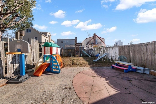 view of playground with a patio