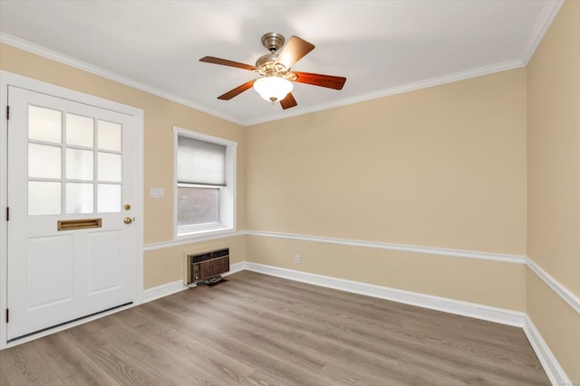 21 S Village Ave Unit 3, Rockville Centre, NY 11570 - entryway with crown molding, heating unit, ceiling fan, and wood finished floors