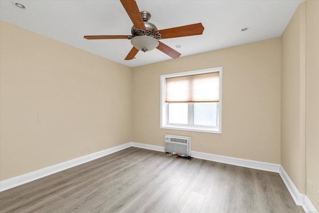 21 S Village Ave Unit 3, Rockville Centre, NY 11570 - spare room with a wall mounted air conditioner, a ceiling fan, baseboards, recessed lighting, and wood finished floors