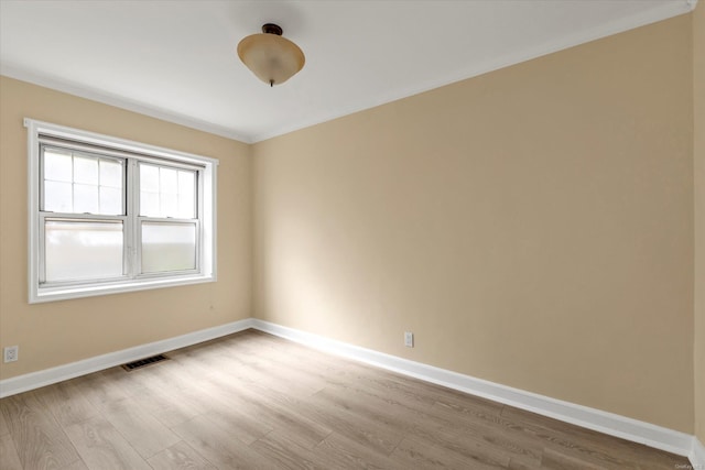 21 S Village Ave Unit 3, Rockville Centre, NY 11570 - spare room featuring light wood-style floors, baseboards, and visible vents