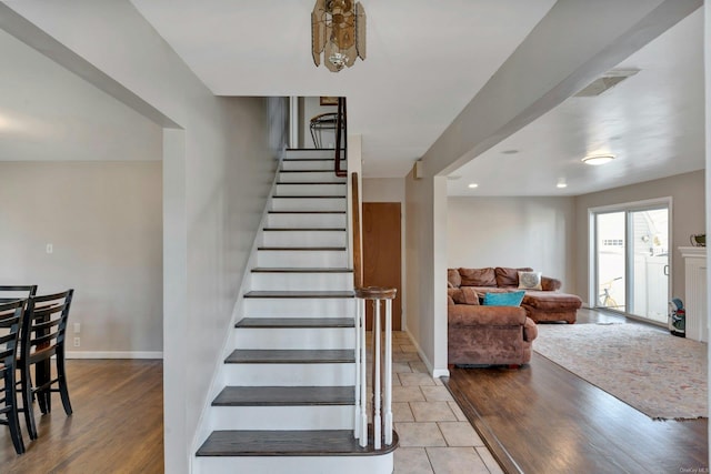 stairway featuring tile patterned floors