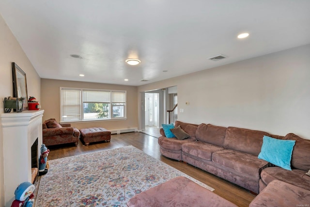 living room with wood-type flooring and a baseboard radiator