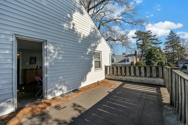 view of side of home featuring a patio