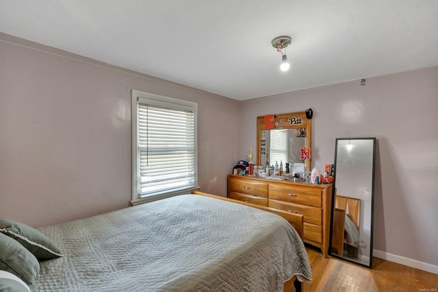 bedroom featuring light hardwood / wood-style floors