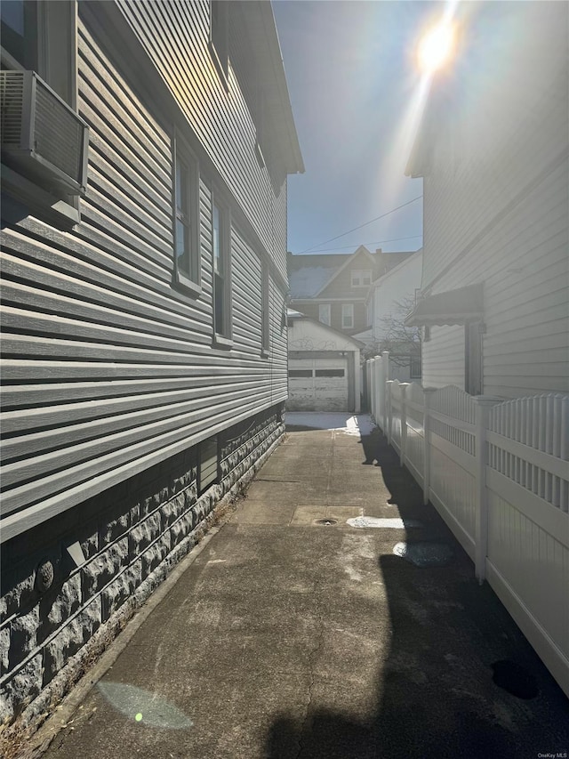 view of side of home featuring a patio area