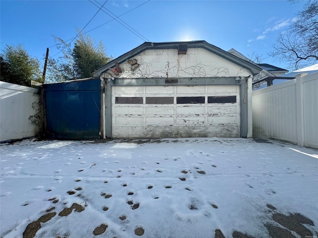 view of snow covered garage