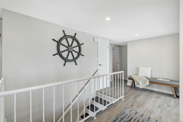 hallway with light hardwood / wood-style flooring