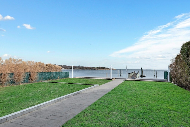 exterior space with a boat dock and a water view