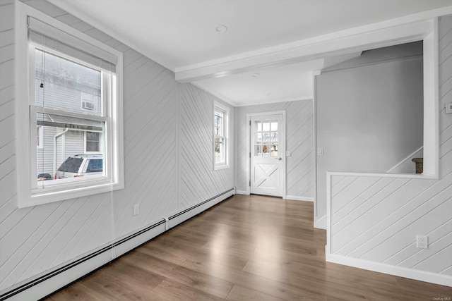 entryway featuring dark wood-type flooring and a baseboard radiator