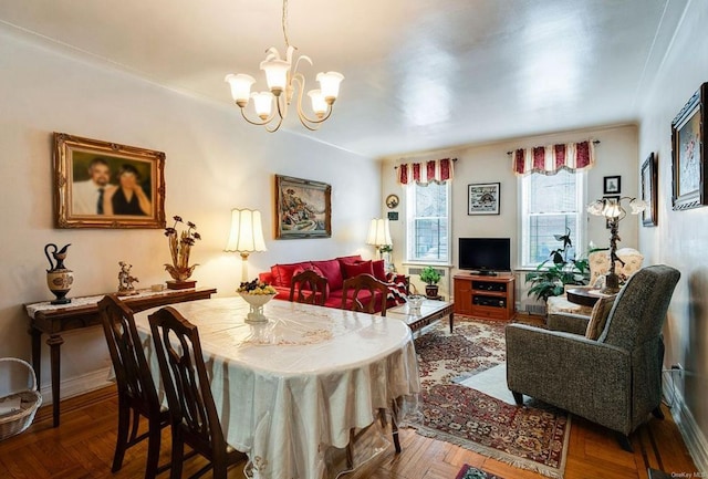 dining room featuring a notable chandelier and parquet flooring