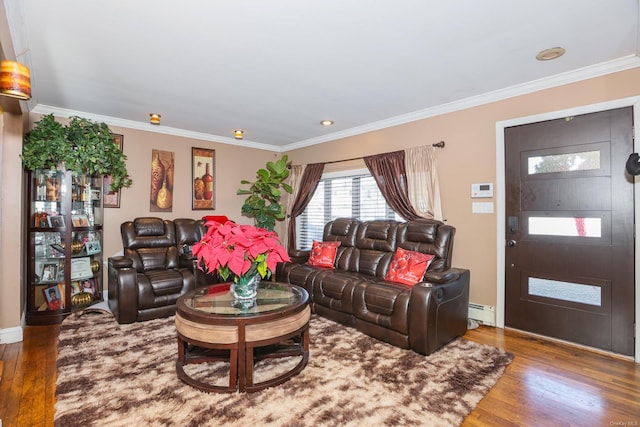 living room with hardwood / wood-style flooring, crown molding, and a baseboard heating unit