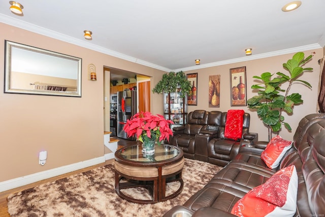 living room with hardwood / wood-style floors and crown molding