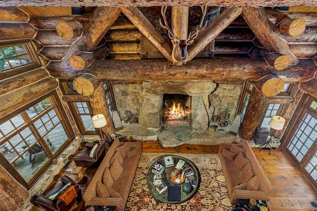 interior space featuring hardwood / wood-style flooring and rustic walls