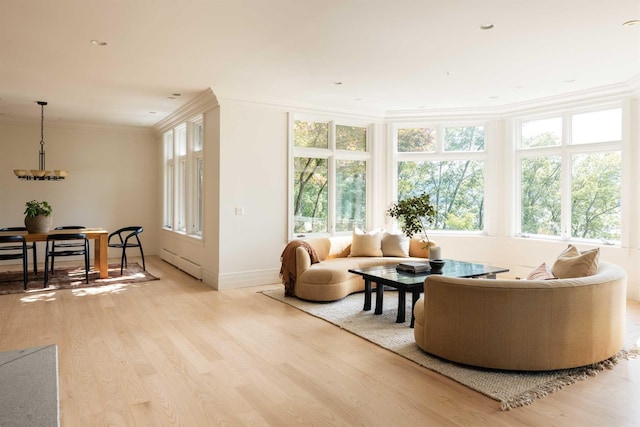 sunroom / solarium with baseboard heating and a wealth of natural light