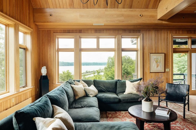 sunroom / solarium with a water view and plenty of natural light