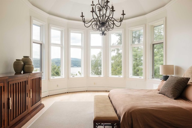 carpeted bedroom with an inviting chandelier and crown molding