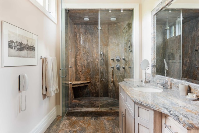 bathroom featuring vanity and an enclosed shower