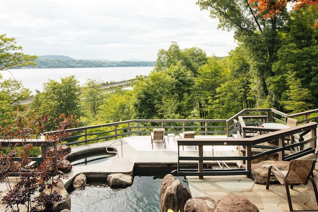 wooden deck with a water view