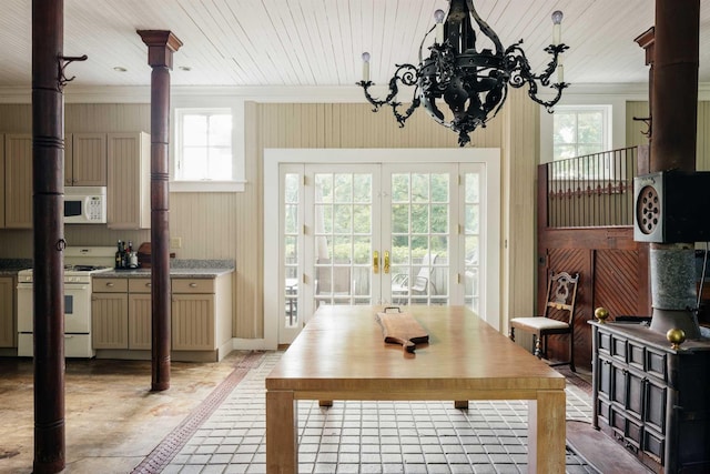 dining space with french doors and wood ceiling