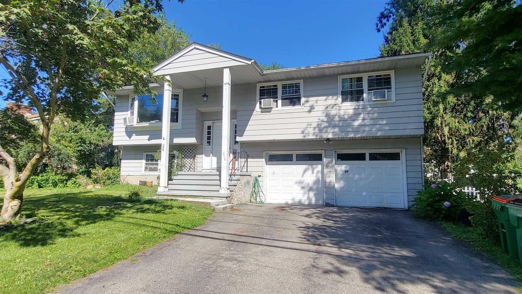 258 Vassar Rd, Poughkeepsie, NY 12603 - raised ranch featuring a garage and a front yard