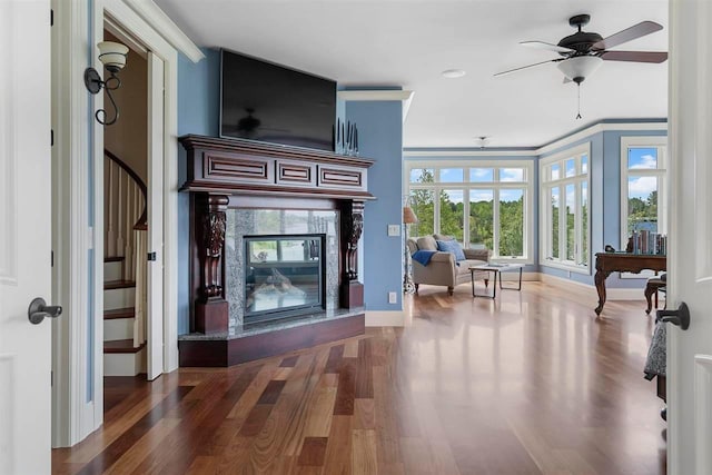 living room featuring dark hardwood / wood-style flooring and ceiling fan