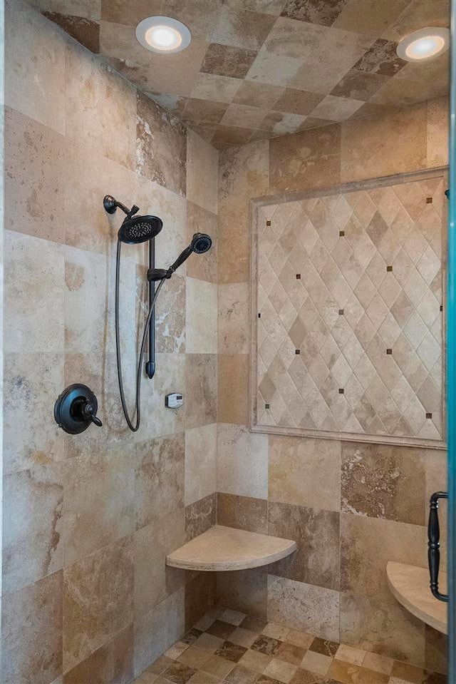 bathroom with tile walls and tiled shower