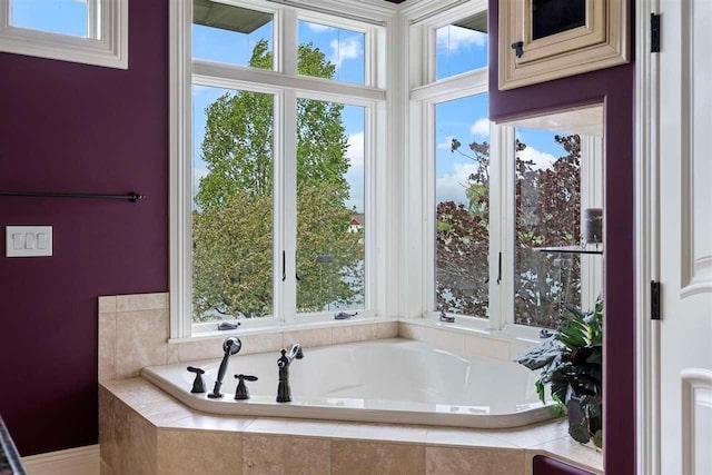 bathroom featuring tiled bath