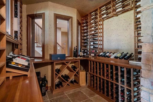 wine cellar featuring dark tile flooring