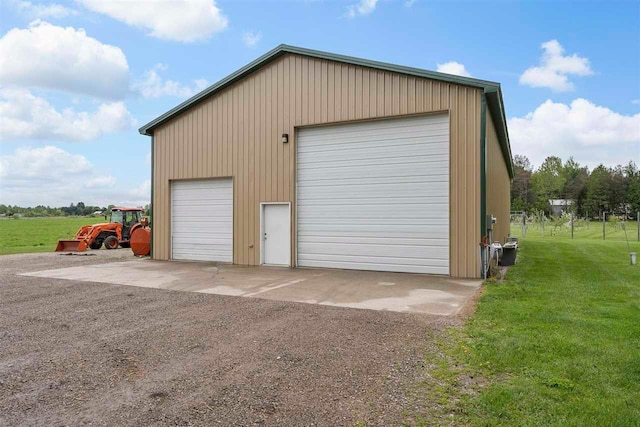 garage with a yard