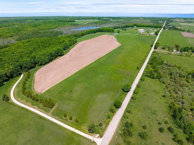 bird's eye view featuring a water view and a rural view