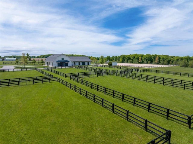 view of yard with a rural view and an enclosed area