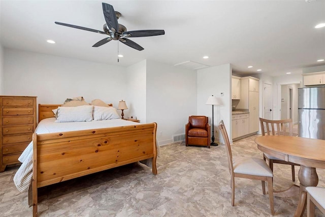 bedroom with freestanding refrigerator, connected bathroom, visible vents, and recessed lighting