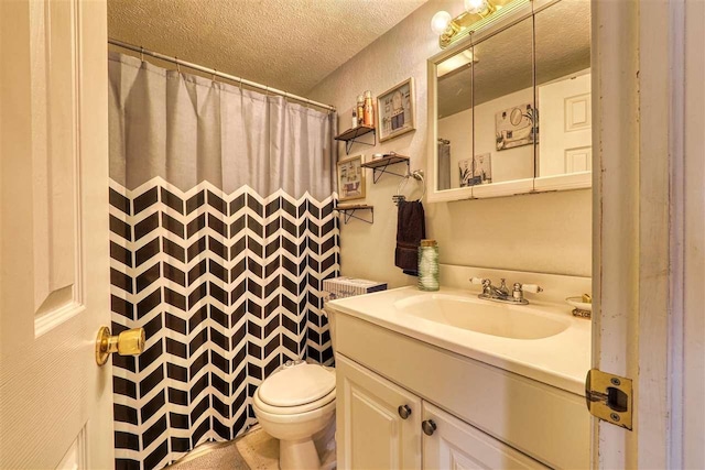 bathroom featuring vanity, a shower with curtain, a textured ceiling, and toilet