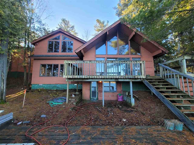 back of house featuring a wooden deck