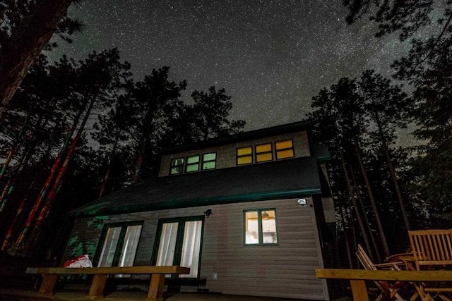 view of back house at night